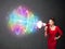 Young girl yells into a loudspeaker and colorful energy beam com