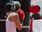 Young Girls doing Fitness and Boxing Workout with Punching Bag