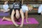 Young girls doing morning exercises on karimats