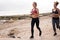 Young girls jogging along the sea side