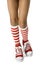 Young girls legs wearing long red striped socks