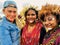 Young girls of a papuan tribe in a beautiful crown from bird feathers