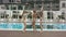 Young Girls Relaxing At The Pool