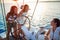 Young girls sailing on boat together and enjoy at sunset on vacation