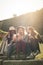 Young girls sitting on the stairs at the public park. Thre