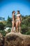 Young girls on stones on a beach