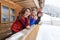 Young Girls On Terrace Wooden Country House Winter Snow Resort Cottage