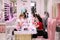 Young girls use the service of Express manicure in the salon of