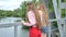 Young girls are walking along the bridge enjoying an amazing view.