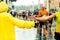 Young give his hand to a runner during the marathon