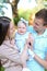 Young gladden parents holding little daughter.