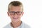 Young glasses boy child portrait in white background