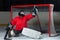 Young goalkeeper catching a puck