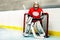 Young goaltender protecting net during the game