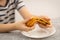 Young gourmet: A kid preparing to relish a delectable puff pastry creation against a white backdrop