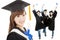 Young graduate girl student holding diploma with classmates