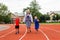 Young grandmother runs a sports stadium with the grandkids