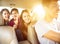 Young group people enjoying road trip in the car