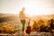 Young guitarist holding an acoustic guitar and looking to sunset.Finding inspiration.Sucessful music creator.New upcoming artist,