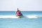 Young guy cruising on a jet ski