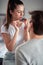 A young guy enjoying feeding his girlfriend in the morning at home. Couple, love, breakfast, together