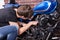 Young Guy Fixing Some Parts of his Motorbike