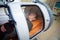 Young guy in a hyperbaric chamber, oxygen treatment