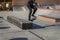 Young guy jumping skateboard on a special hill. Street sport, active lifestyle