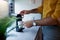 A young guy making a tea at the kitchen. Routine, morning