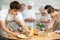 Young guy pours sauce into dish at master class