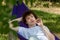 Young guy resting in a hammock in nature