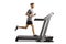 Young guy running on a professional treadmill