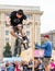 Young guy is showing extreme jumps on a skate stage