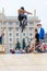 Young guy is showing extreme jumps on a skate stage