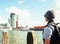 Young guy tourist looking to view Rotterdam city harbour, future