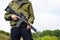 A young guy is trained in combat shooting from a rifle AR 15.