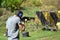 A young guy is trained in combat shooting from a shotgun.