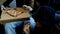 Young guys eating delicious pizza sitting on the sofa