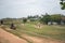 Young guys play bast shoes with friends on the grass at Fort Galle