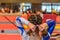 Young gymnast girl fixing hair before appearance