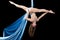 Young gymnast training on aerial silk