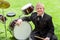 Young handicapped drummer next to drums.