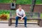 Young handsome American Man relaxing at street park in New York