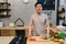 Young handsome asian man prepare salad food and cooking in the kitchen.