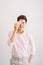 Young handsome asian man reads greeting card with heart shape on white background