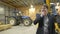 Young handsome businessman thinking inside wooden construction site