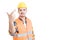 Young handsome constructor or engineer holding crossed fingers a