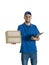 Young handsome courier guy making delivery of a parcel