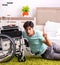 Young handsome disabled man recovering at home
