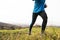 Young handsome hipster athlete running in sunny autumn nature